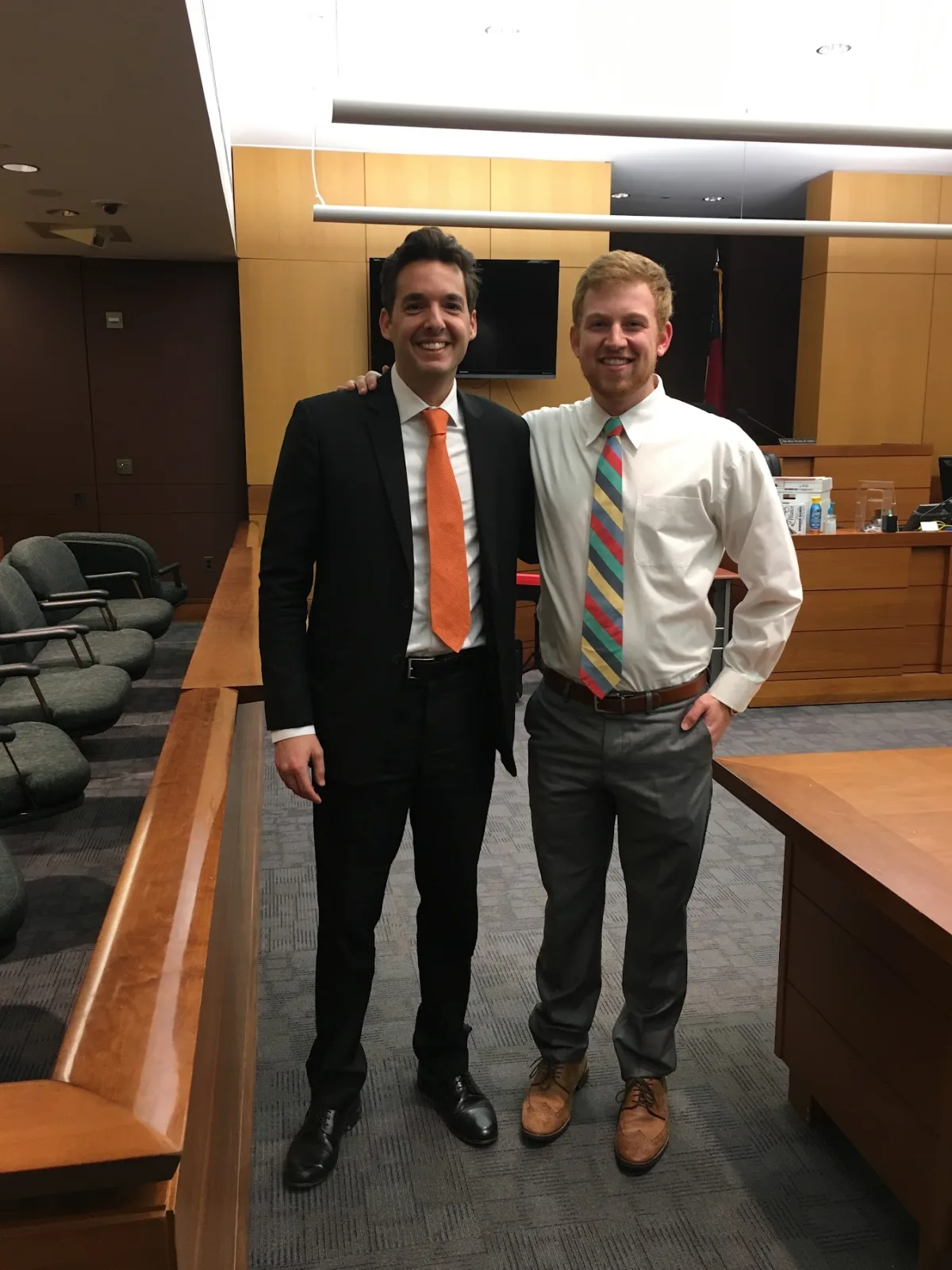 Matt Wetherington standing with his client in a Fulton County courtroom after the verdict