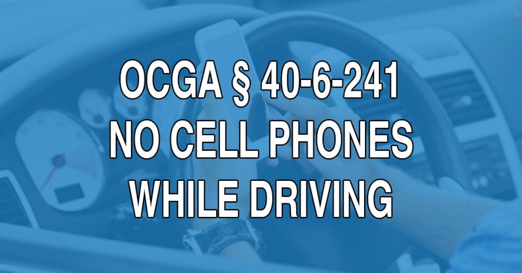 It’s illegal to hold any of the devices controlled by 40-6-241, whether connective or standalone, in your hand while driving. Drivers must be hand-free on Georgia roads.