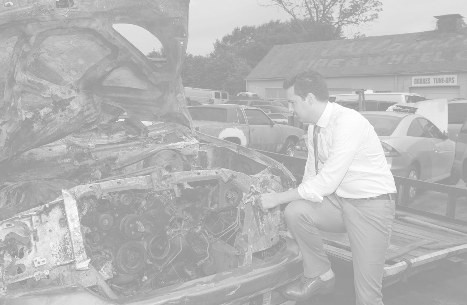 Matt inspecting wrecked vehicle