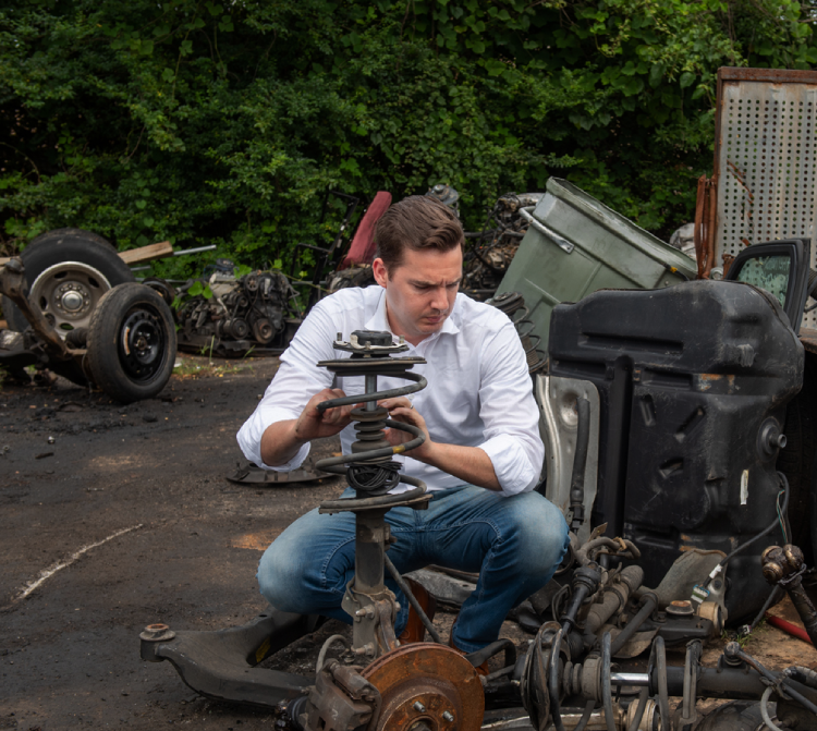 attorney Matt Wetherington, inspecting a car after a crash.
